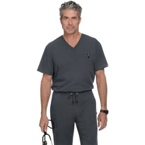 A grey V-neck scrub top with a pocket, worn by a man holding glasses. The design features a logo.