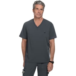 A grey scrubs top with a V-neck design and a pocket, worn by a model. The top features a logo.