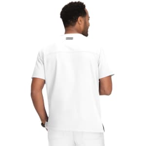 A man wearing a white short-sleeve shirt, viewed from the back, displaying a simple design and branding.