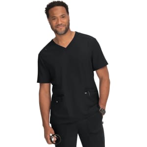 A man wearing a black medical scrub top with a v-neck and two front pockets, smiling at the camera.