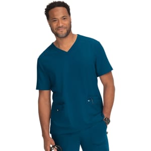 A man wearing a teal V-neck medical scrub top with two front pockets and a logo on the chest.
