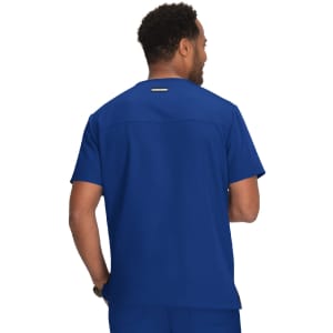 A scrubs top in royal blue, designed for medical professionals, featuring a simple logo on the back.