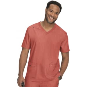 A man wearing a coral-coloured medical scrub top with a V-neck and two front pockets.