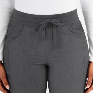 A pair of women's tapered pants in dark grey, featuring a drawstring waistband and two pockets.