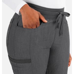 A pair of women's tapered pants in grey with a waistband tie and pockets. Features a logo.