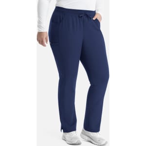 A pair of navy tapered pants with a waistband and pockets, designed for women's yoga. A logo is visible.