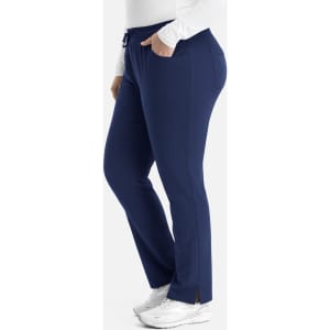 A tapered pant in navy blue with pockets and a logo, featuring a drawstring waist.