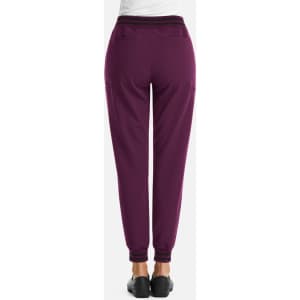 A pair of women's joggers in a deep purple colour with a metallic detail. Features an elastic waistband and side pockets.
