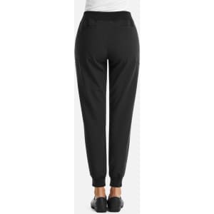 A black pair of women's joggers with a full waist and elastic cuffs, featuring pockets and a logo.