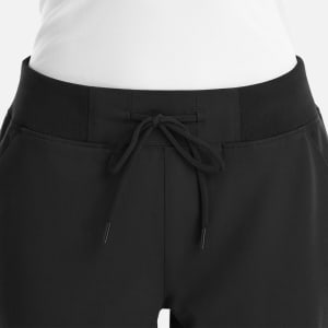 A black jogger featuring a full waist design and drawstring detail at the waist. It includes a logo on the garment.