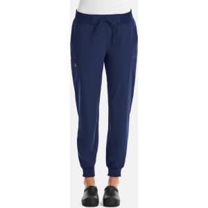 A pair of women's joggers in navy blue with elastic cuffs and pockets, featuring a branding logo.