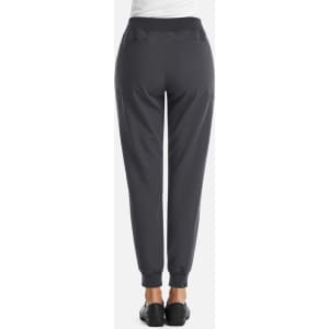 A pair of women's joggers in dark grey with a fitted waistband and ankle cuffs, featuring pockets.