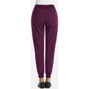 A pair of women's joggers in deep purple, featuring a fitted waistband and pockets at the back.