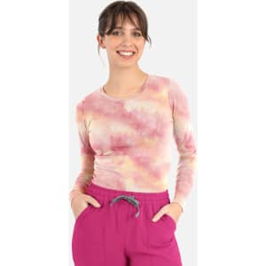 A long-sleeved women's underscrub tee in a pastel tie-dye pattern featuring shades of pink and yellow.