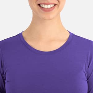 A purple women's underscrub tee with a round neckline, featuring a smiling model.