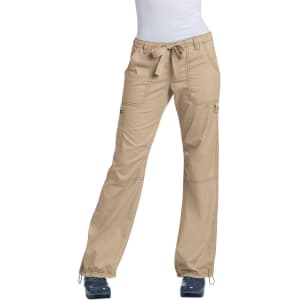 A pair of beige pants with a drawstring, featuring pockets and a slight flared design.