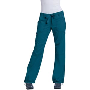 Teal scrubs pants with a drawstring waist and pockets, displayed on a model. Features a logo on the fabric.