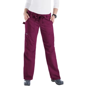 A pair of burgundy pants with a drawstring waist, featuring pockets and a logo on the side.