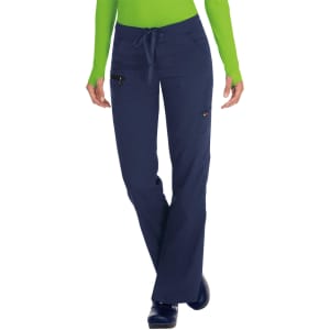 Navy blue pants with pockets, featuring a drawstring waist and worn by a model in a green top.