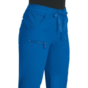 Blue pants featuring a drawstring waist and multiple pockets. The product includes a small zip pocket and has branding.