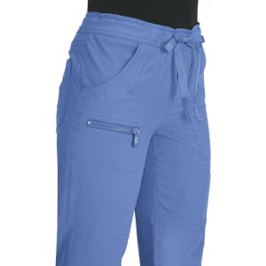 Light blue pants featuring pockets and a drawstring waist, with a zippered pocket and a logo visible.
