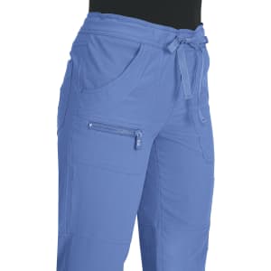 Blue pants with a drawstring waist and multiple pockets, featuring a logo on the side.