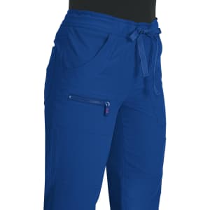 A pair of blue trousers featuring pockets and a logo, designed with a tie waist.