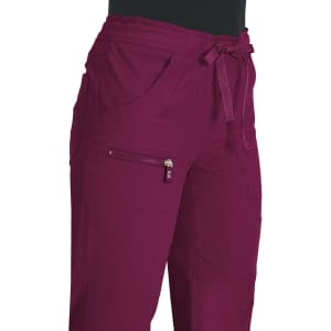A pair of burgundy pants with pockets and a drawstring waist, featuring a zippered pocket.