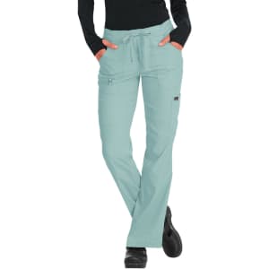 A pair of light teal pants with pockets and a drawstring waist, featuring a logo on the side.
