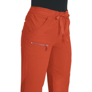 An orange pair of pants with a drawstring waist and zippered pocket details.