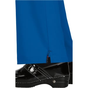 Bright blue pants with a side slit, paired with shiny black clogs. The pants feature a logo on the side.