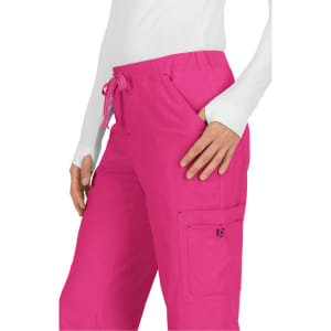 A pair of bright pink pants with a drawstring waist and side pockets, featuring a logo on the pocket.