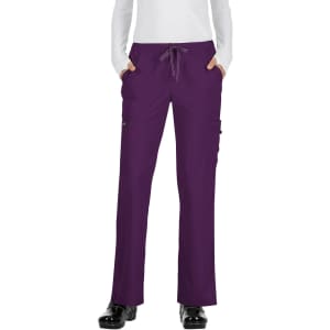 A pair of purple pants with pockets and a drawstring waistband. The model is wearing black shoes.