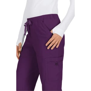 A pair of purple pants with a drawstring waist and pockets, featuring a logo on the side.