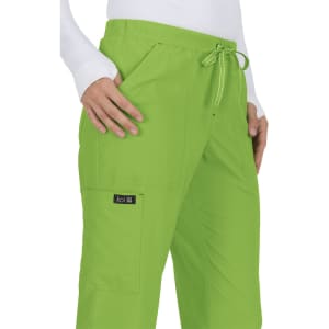 Bright green pants with side pockets and a drawstring waist, featuring a logo tag.