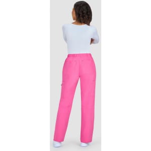 A pair of pink pants with a relaxed fit and pockets, viewed from the back, worn with a white top.