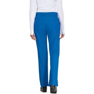 A woman standing with her back to the camera, wearing bright blue pants. The pants feature a waistband and pockets.