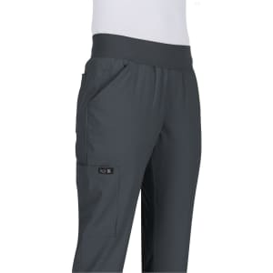 A pair of dark grey pants with a flexible waistband and pockets, featuring a logo on the side.
