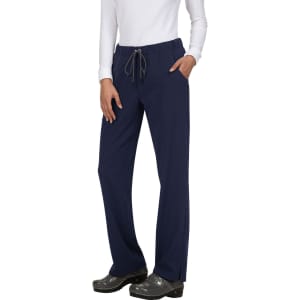 Navy blue pants with a drawstring waist and side pockets, worn by a model in a white top and shoes.