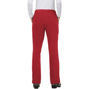 A pair of red pants is displayed, featuring pockets and a fitted waistband, with a person wearing a white top.