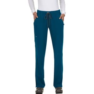 Teal pants with a drawstring waist, featuring pockets, displayed on a model standing with hands in pockets.