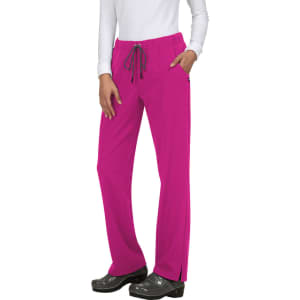 A pair of bright pink pants with a drawstring waist and pockets, worn by a model in a white top.
