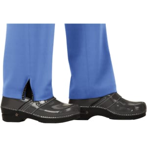 Blue pants with a split hem, paired with black, glossy clogs. The pants have a simple, clean design.