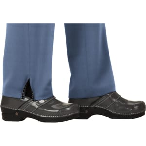 Blue pants with a slit at the hem, paired with black shoes featuring a shiny finish.