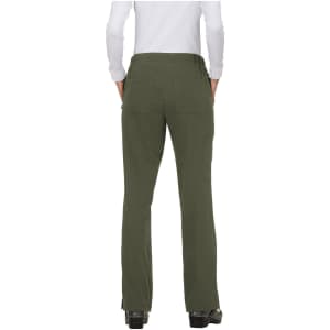 A pair of green pants viewed from the back, featuring pockets and a fitted waist. Logo visible on the fabric.