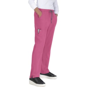 A pair of pink pants with pockets, featuring a drawstring waist and worn with black sneakers.
