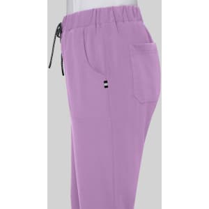 A pair of lilac pants with an elastic waistband, side pockets, and a small logo.