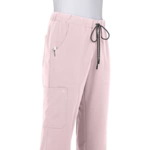 A pair of light pink pants with an elastic waistband and drawstring, featuring pockets and stitching details.