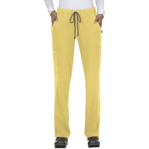 A pair of yellow pants with pockets and a drawstring waist, modelled by a person in a white top.