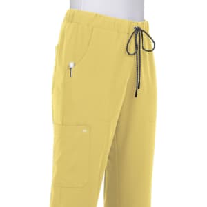 A pair of yellow pants with an elastic waistband and drawstring, featuring pockets and a logo.